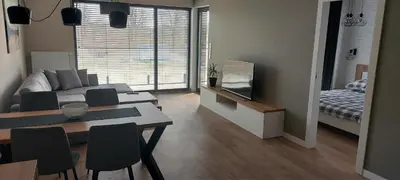 Łóżko lub łóżka w pokoju w obiekcie Ozimska77