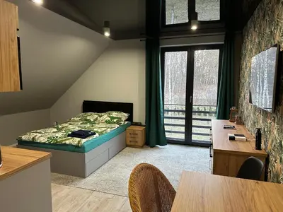 Łóżko lub łóżka w pokoju w obiekcie Apartament nad Jeziorem