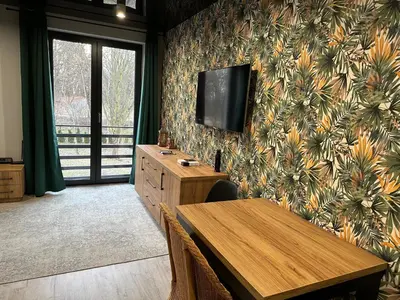 Telewizja i/lub zestaw kina domowego w obiekcie Apartament nad Jeziorem