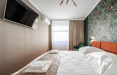 Łóżko lub łóżka w pokoju w obiekcie APARTMENT 24H WITH FREE GARAGE AND AC Jagiełły 5
