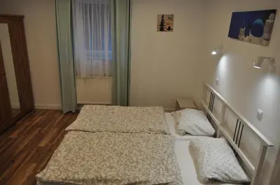 Łóżko lub łóżka w pokoju w obiekcie Apartament u Zięby