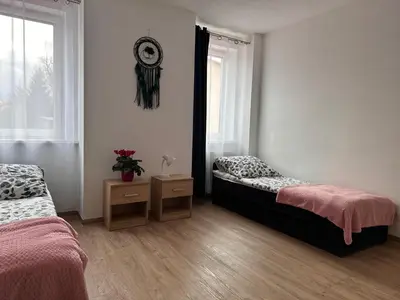 Łóżko lub łóżka w pokoju w obiekcie Agroturystyka Pod Świerkami