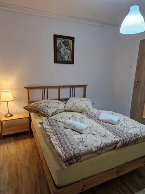 Łóżko lub łóżka w pokoju w obiekcie Apartament w Centrum