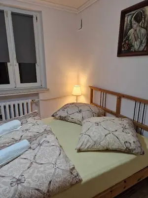 Łóżko lub łóżka w pokoju w obiekcie Apartament w Centrum