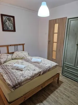 Łóżko lub łóżka w pokoju w obiekcie Apartament w Centrum
