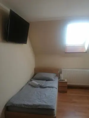 Łóżko lub łóżka w pokoju w obiekcie Nad Wilczym Potokiem
