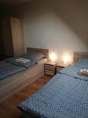 Łóżko lub łóżka w pokoju w obiekcie Nad Wilczym Potokiem