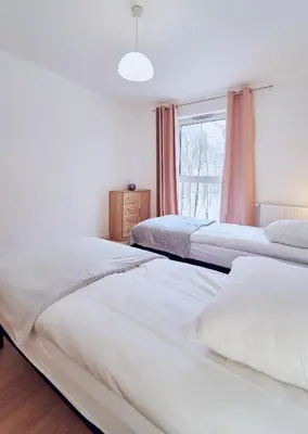 Łóżko lub łóżka w pokoju w obiekcie Marel-Apartment Willa Fonte - apartament 8