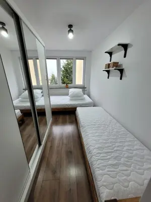Łóżko lub łóżka w pokoju w obiekcie Apartament Stadion