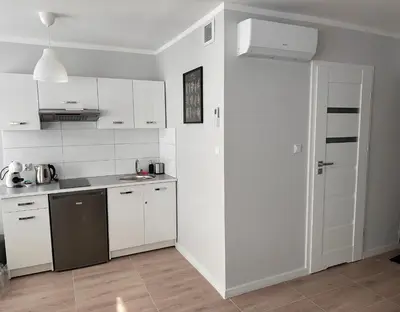 Kuchnia lub aneks kuchenny w obiekcie APARTAMENT OŚ. ZŁOTE 5F
