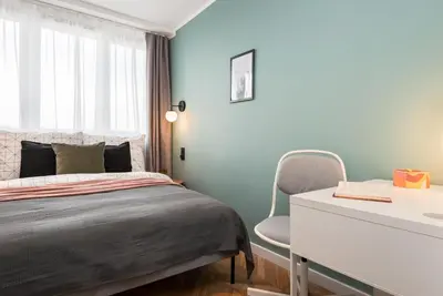 Łóżko lub łóżka w pokoju w obiekcie Kairos Apartments - Szafir - darmowy Parking, ścisłe centrum