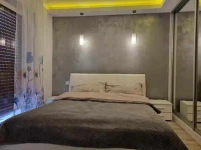 Łóżko lub łóżka w pokoju w obiekcie Apartament na obrzeżach Kalisza