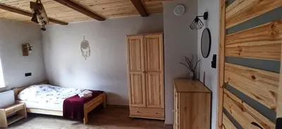 Łóżko lub łóżka w pokoju w obiekcie Górska Chata Lasówka