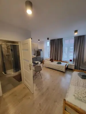 Łóżko lub łóżka w pokoju w obiekcie Apartamenty - Studio Gliwice II