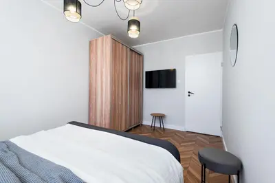 Łóżko lub łóżka w pokoju w obiekcie Kairos Apartments - Friends - darmowy Parking, blisko centrum