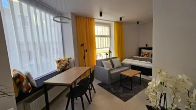 Łóżko lub łóżka w pokoju w obiekcie Apartament na Wodnej