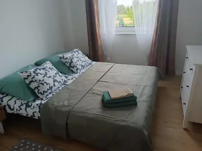 Łóżko lub łóżka w pokoju w obiekcie Oława Chabrów