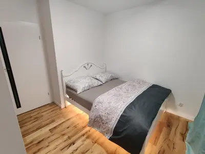 Łóżko lub łóżka w pokoju w obiekcie DOMAR APARTAMENT