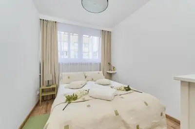 Łóżko lub łóżka w pokoju w obiekcie Wrocław City Centre & Main Square Apartment by Noclegi Renters