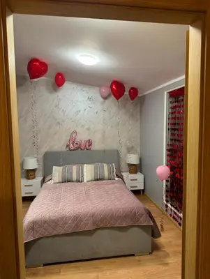 Łóżko lub łóżka w pokoju w obiekcie Dawna Mleczarnia Apartamenty FAMILIJNY