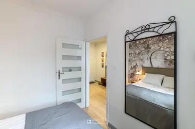 Łóżko lub łóżka w pokoju w obiekcie Apartament Kudowianka
