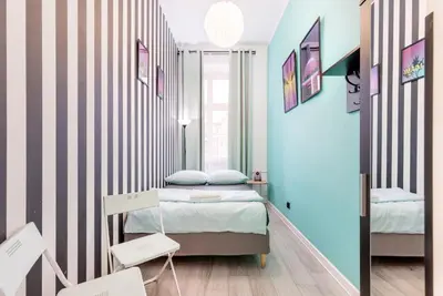 Łóżko lub łóżka w pokoju w obiekcie VICE CITY Hostel