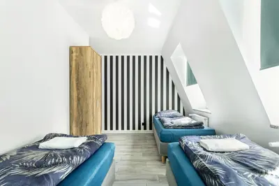 Łóżko lub łóżka w pokoju w obiekcie VICE CITY Hostel