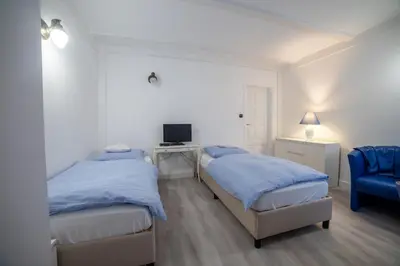 Łóżko lub łóżka w pokoju w obiekcie Ośrodek LBN-HUTA