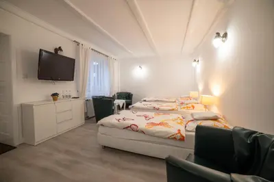 Łóżko lub łóżka w pokoju w obiekcie Ośrodek LBN-HUTA