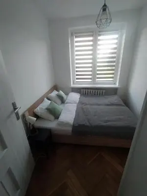 Łóżko lub łóżka w pokoju w obiekcie Apartamenty Amelia