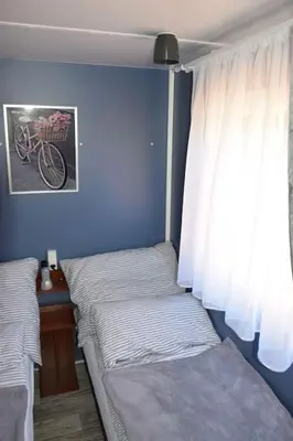 Łóżko lub łóżka w pokoju w obiekcie Wakacyjny Domek Słoszów 3