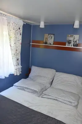 Łóżko lub łóżka w pokoju w obiekcie Wakacyjny Domek Słoszów 3
