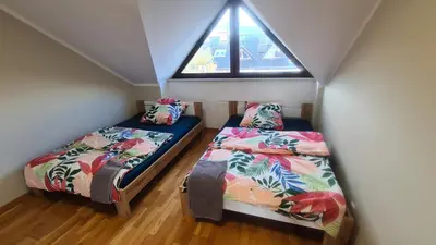 Łóżko lub łóżka w pokoju w obiekcie Dom pod Wroclawiem13