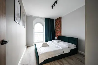 Łóżko lub łóżka w pokoju w obiekcie Młyn Wrocław 10/8