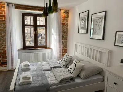Łóżko lub łóżka w pokoju w obiekcie Apartament Przy Ratuszu