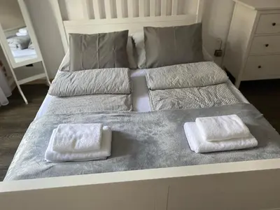 Łóżko lub łóżka w pokoju w obiekcie Apartament Przy Ratuszu