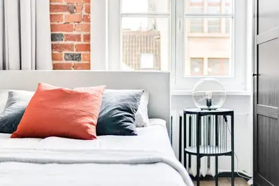 Łóżko lub łóżka w pokoju w obiekcie Apartament Plac Jana Pawła 7 Centrum Wrocław