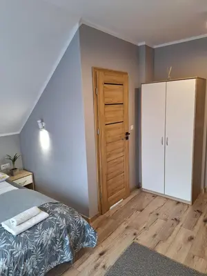 Łóżko lub łóżka w pokoju w obiekcie Apartamenty Dębowy Zakątek w Dolinie Baryczy
