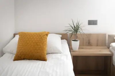 Łóżko lub łóżka w pokoju w obiekcie Apartament Centrum B