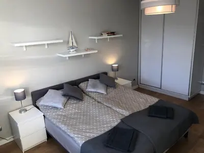 Łóżko lub łóżka w pokoju w obiekcie Apartament BROWARNY