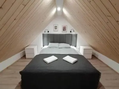 Łóżko lub łóżka w pokoju w obiekcie Stara Kuźnia