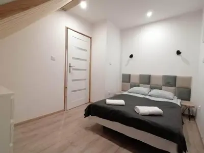 Łóżko lub łóżka w pokoju w obiekcie Stara Kuźnia
