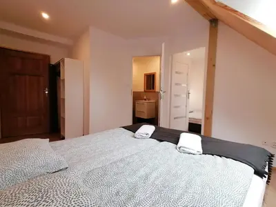 Łóżko lub łóżka w pokoju w obiekcie Stara Kuźnia
