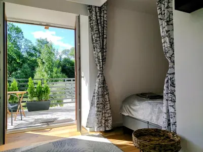 Łóżko lub łóżka w pokoju w obiekcie nowy Apartament z tarasem i samodzielnym wejściem - Willa Sowia