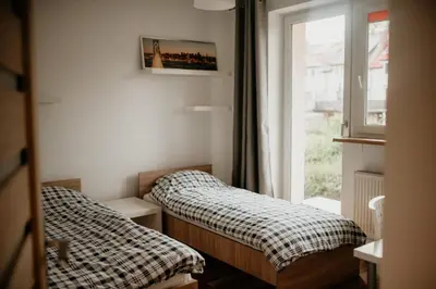 Łóżko lub łóżka w pokoju w obiekcie Dom na Lawendowej