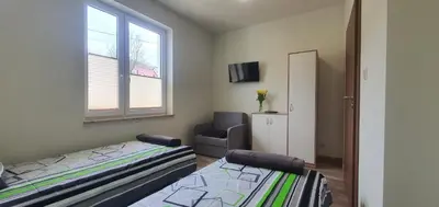 Łóżko lub łóżka w pokoju w obiekcie Zajazd Stronie