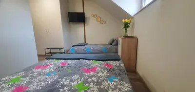 Łóżko lub łóżka w pokoju w obiekcie Zajazd Stronie