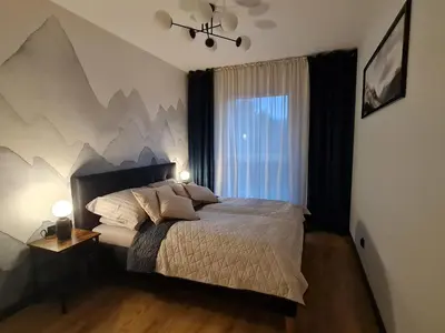 Łóżko lub łóżka w pokoju w obiekcie Komfortowy Apartament Pod Lasem Villa Fonte 21 Polanica Zdrój