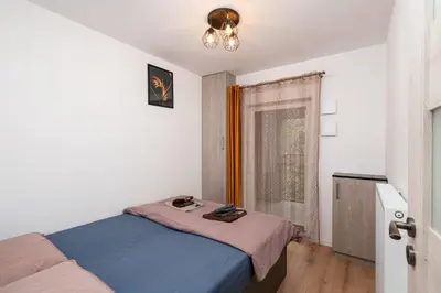 Łóżko lub łóżka w pokoju w obiekcie ApartWro 3th - apartament przy dworcu głównym PKP, balkon, garaż, rowery
