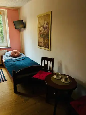 Łóżko lub łóżka w pokoju w obiekcie Domek w Lesie